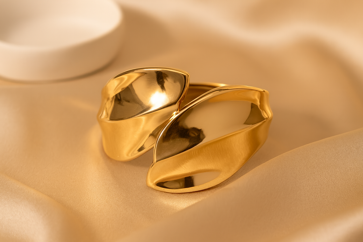Gold ring on a beige fabric background