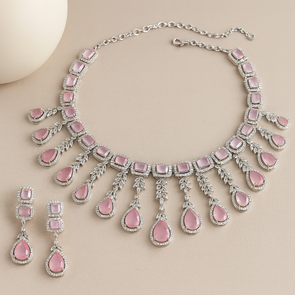 Necklace with pink teardrop-shaped stones on a beige background