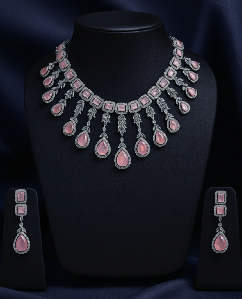 Jewelry set with necklace and earrings on a black stand