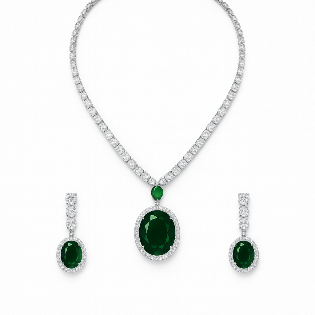 Jewelry set with emerald green gemstones and diamond accents on a white background